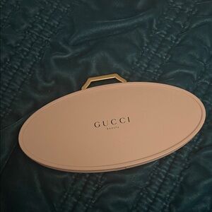 Gucci Pink Oval Mirror with Gold Accents